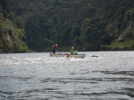 Steve pushing the canoe along over the shallow water